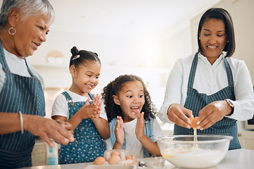Image showing Grandmother, mom or excited children baking in kitchen as a happy family with young girl learning a recipe. Cracking eggs, clapping or grandma smiling or teaching kids to bake a cake for development