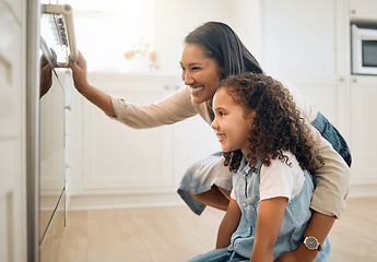 Image showing Mother, oven or child baking in kitchen as a happy family with young girl learning cookies recipe. Cake, wait or mom smiling, helping or teaching daughter to bake with a smile for development at home