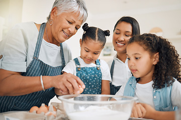 Image showing Grandmother teaching, mom or kids baking in kitchen as a happy family with young girl learning a recipe. Mixing cake, parent or grandma smiling or helping children to bake with eggs for development