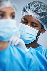 Image showing Surgery, preparation and doctor team getting ready in hospital for medical, innovation and operation. Healthcare, experts and woman with man in theater for uniform, teamwork and medical collaboration