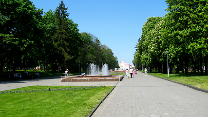 Image showing People have a rest in park with trees and fountains