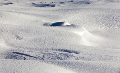 Image showing Deep snowdrifts - a winter frosty morning. On the ground lay snowdrifts after a night of snow