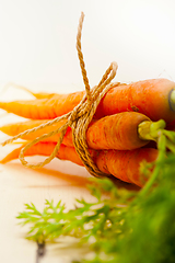Image showing baby carrots bunch tied with rope