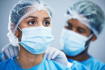 Image showing Uniform, preparation and doctor team getting ready in hospital for medical, innovation and operation. Healthcare, experts and woman with man in theater for surgery, teamwork and medical collaboration