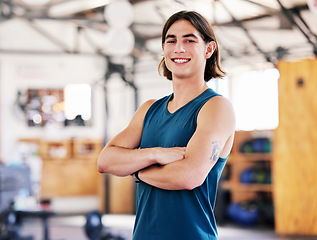 Image showing Coach, portrait and man with arms crossed in gym ready to start training, workout or exercise for health and wellness. Fitness, face and smile of confident athlete or personal trainer from Canada.