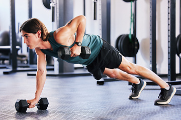 Image showing Fitness, dumbbell and push up with a man at gym for a workout, biceps exercise or training. Male athlete person with iron weights for strong muscle, focus and agile performance at wellness club