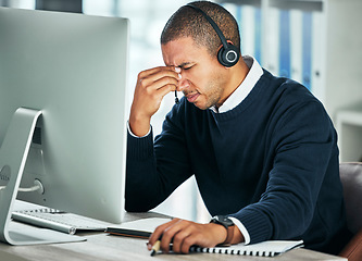 Image showing Stress, call center and a man with a headset at computer for customer service problem. African person consultant at pc with headache for telemarketing mistake, crm support and help desk or sales fail