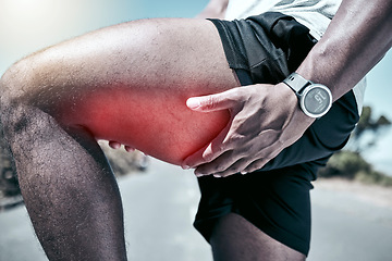 Image showing Fitness, thigh and injury with a sports man holding his muscle in pain while outdoor for a workout. Exercise, anatomy and accident with a male athlete feeling strain while training for recreation