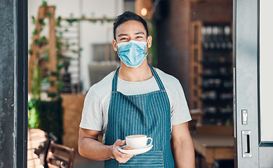 Image showing Barista, man and face mask portrait with coffee with hospitality and service in a small business. Restaurant, hot drink and cafe owner at door with latte and cappuccino of manager and entrepreneur