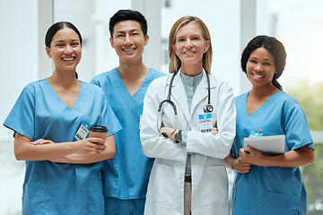 Image showing Portrait, medical and a woman doctor arms crossed, standing with her team in the hospital for healthcare. Leadership, health and teamwork with a female medicine professional in a clinic for treatment