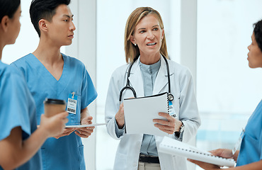 Image showing Teamwork, discussion or doctors with a report in meeting planning a surgery strategy in collaboration. Leadership, woman or surgeons talking or speaking of healthcare paperwork, documents or research