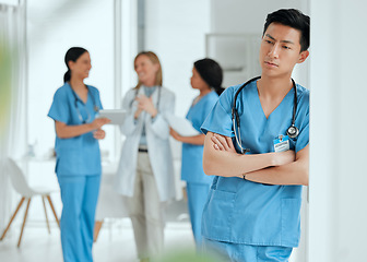 Image showing Thinking, stress or sad nurse in hospital meeting with burnout, anxiety or worried with medical emergency. Worry, tired man or depressed Asian healthcare doctor with grief or depression in clinic