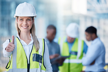 Image showing Portrait, thumbs up and a woman construction worker outdoor on a building site with her team in the background. Management, thank you and support with a happy female architect outside for motivation