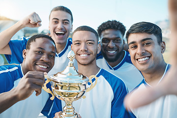 Image showing Sports group, soccer trophy and selfie of team on field for game award or prize outdoor. Football player, club and diversity champion men portrait for sport competition win, success and achievement