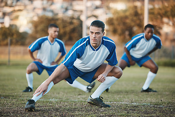 Image showing Sports group, soccer and team stretching on field for fitness training or game outdoor. Football player, club and athlete people with focus for sport competition, legs workout or warm up challenge