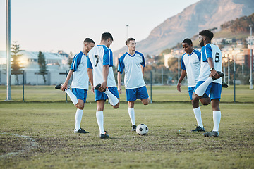 Image showing Soccer, team sports and stretching exercise on field for fitness, diversity and training outdoor. Football ball, pitch and club for athlete men together for sport competition, legs or muscle warmup
