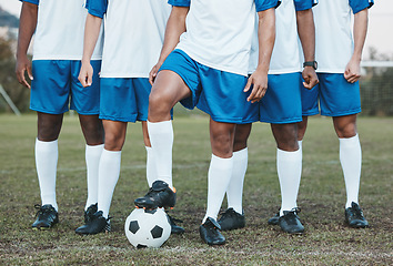 Image showing Soccer ball, sports group and feet of a team on a field to start fitness training or game outdoor. Football player, club and legs of athlete men together for sport competition, exercise and challenge