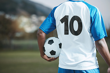 Image showing Soccer ball, sports and man with uniform number on a field for exercise, fitness and training outdoor. Football club, pitch and event or game with athlete person and mockup for sport competition