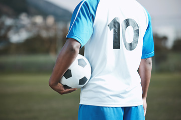 Image showing Sports, soccer ball and man with uniform number on a field for exercise, fitness and training outdoor. Football club, pitch and event or game with athlete person and mockup for sport competition