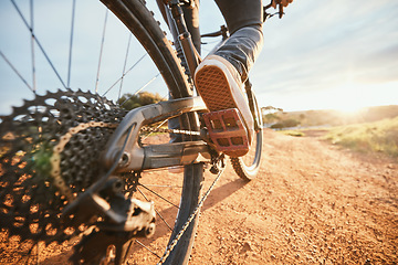 Image showing Summer, cycling and a man on a bike and dirt road for fitness, morning cardio or adventure in nature. Sports, feet and a person on a bicycle for a race, competition or exercise in the countryside