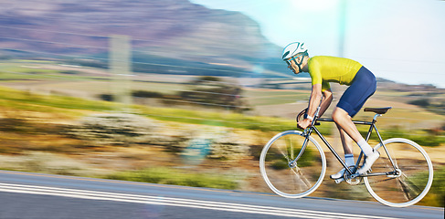 Image showing Fast, fitness and a man cycling on the road for cardio, sports or marathon training on a bike. Focus, exercise and a moving cyclist on bicycle for a challenge, triathlon or competition in the street