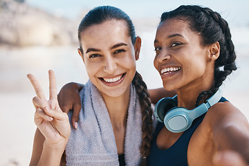 Image showing Women friends, beach selfie and peace sign in portrait for exercise, health or hug with fitness in nature. Latino girl, black woman and photography for profile picture, social network and blog update