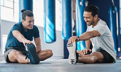 Image showing Men smile, gym and legs stretching of friends before training, fitness and workout in health club. Warmup, athlete and man ready to start sport exercise together on the floor with personal trainer