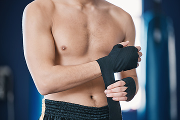 Image showing Sports, boxing and man wrap hands in gym for training, workout and exercise for mma fight. Fitness, body builder and male athlete with bandage prepare for boxer competition, practice and performance