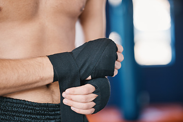 Image showing Fitness, boxing and man wrap hands with closeup in gym for training, workout and exercise. Sports, body builder and male athlete ready with bandage for boxer competition, practice and mma fight