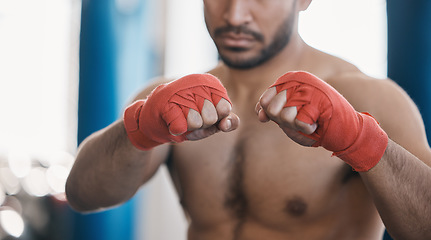 Image showing Sports, boxing and hands of man punch in gym for training, workout and exercise for mma fight. Fitness, body builder and closeup of male athlete ready for boxer competition, practice and performance