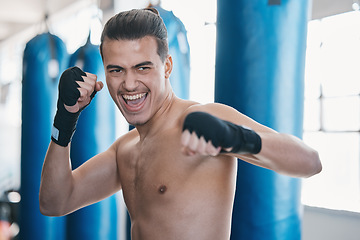 Image showing Sports, boxing and man in gym for training, workout and exercise for martial arts or mma fight. Fitness, body builder and face of excited male athlete ready for boxer competition, practice and punch