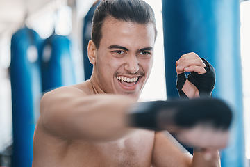 Image showing Sports, boxing and man punch in gym for training, workout and exercise for mma fighting. Fitness, body builder and face of male athlete ready for boxer competition, practice and martial arts match