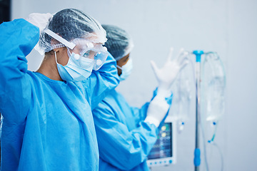 Image showing Doctors in surgery, healthcare and surgical hygiene start with PPE and collaboration in operation theatre in hospital. Medical team, health insurance and safety gear with surgeon people in clinic