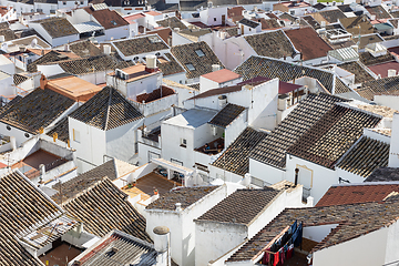 Image showing Aerial panoramic view of rooftops of white houses of Olvera town, considered the gate of white towns route in the province of Cadiz, Spain