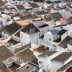 Image showing Aerial panoramic view of rooftops of white houses of Olvera town, considered the gate of white towns route in the province of Cadiz, Spain