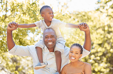 Image showing Black family, mother or father with kid in park to relax with smile or wellness on fun holiday together. African dad, happy mom or child bonding or smiling with lovely parents in nature in Nigeria