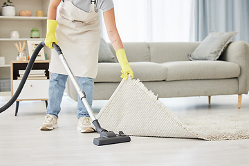 Image showing Carpet, person and vacuum with cleaner, home and remove dust for hygiene, bacteria and lounge. Dirt, worker and maid with cleaning equipment, mat and apartment with housekeeping and spring cleaning