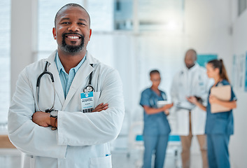 Image showing Happy, doctor and portrait of black man with crossed arms for medical help, insurance and trust. Healthcare, hospital team and face of professional male health worker for service, consulting and care