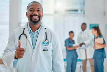 Image showing Thumbs up, doctor and portrait of black man with smile for medical help, insurance and trust in hospital. Healthcare, thank you sign and face of male health worker for service, consulting and care