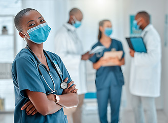 Image showing Face mask, doctor and portrait of black woman with crossed arms for medical help, insurance and trust. Healthcare, hospital team and face of female health worker for service, consulting and care