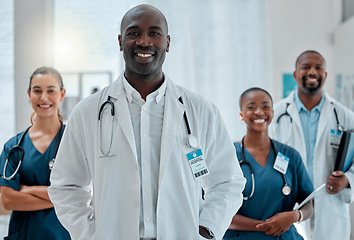 Image showing Happy, doctor and portrait of black man with team for medical help, insurance and trust in clinic. Healthcare, hospital and professional male and women health worker for service, consulting and care