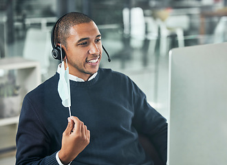 Image showing Customer service, man call center agent with face mask and headset with computer at his modern office workplace. Online communication or networking, crm or telemarketing and male person for support