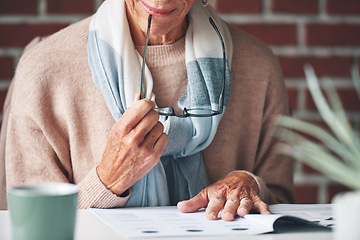 Image showing Mature woman, reading and document in the indoor with closeup and glasses in hand with application. Retirement, information and female person, read for investment or budget with a contract at cafe.