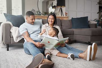 Image showing Mother, father and happy child reading books on living room floor for educational fun, learning and development at home. Family, parents and storytelling with boy kid for love, care or play in lounge