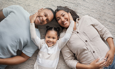 Image showing Top view, mom and dad with portrait of happy child for love, care and bonding of quality time together at home. Face of mother, father and girl kid relax with family in house for fun, smile and play