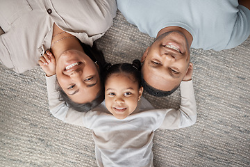 Image showing Top view, parents and happy portrait of kid for love, care and bonding for quality time together at home. Face of mom, dad and happiness of girl child, family and relax in house for fun, joy and play