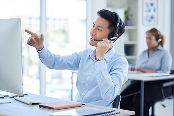 Image showing Computer, call center and man talking on headset for telemarketing or sales account information. Asian person reading desktop for database, technical support or online consultation for user email