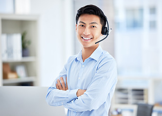 Image showing Call center, portrait and man with arms crossed for telemarketing, customer service and support. Face, contact us and confident sales agent, happy Asian consultant and crm professional from Japan.