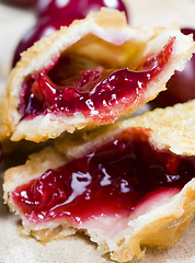 Image showing cherry jam in a crispy bun