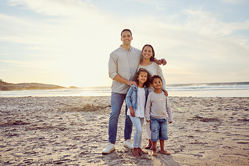 Image showing Travel, beach and portrait of parents with children on holiday, summer vacation and weekend. Nature, sunset and happy mother, father and kids by ocean for bonding, adventure and quality time together